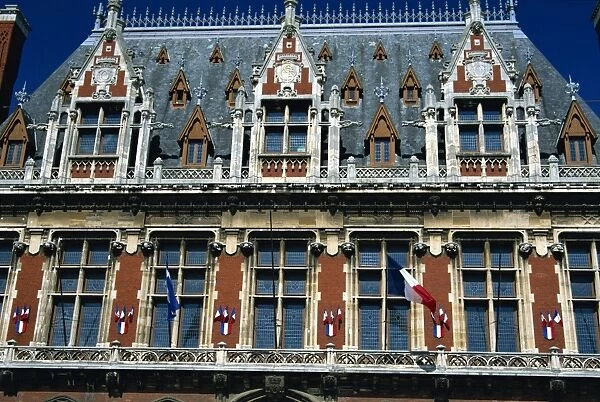 Detail of windows, dormers and flags on the town hall in Calais, Nord Pas de Calais
