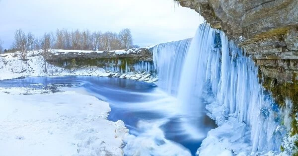 Winter ice covered and snowy waterfall, Estonia, Europe