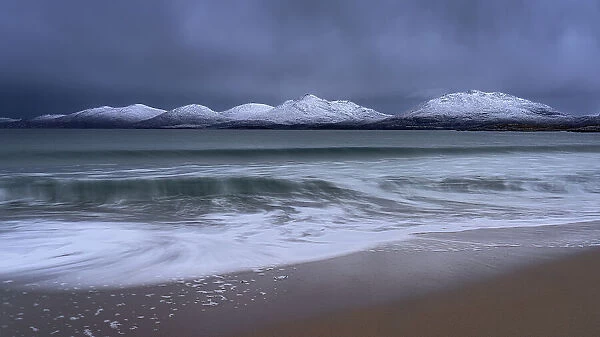 Winter at Luskentyre beach with snow capped mountains, Isle of Harris, Outer Hebrides, Scotland, United Kingdom, Europe