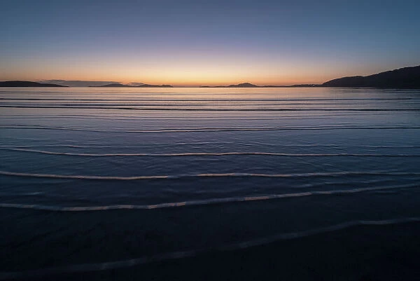 Winter sunrise at high tide, Traigh Mhor, the beach used as Barra Airport at low tide