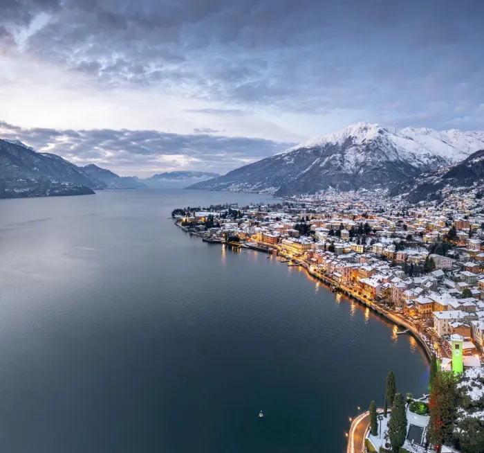 Framed Print : Winter sunrise over the illuminated lakeside town of Gravedona and snowy peaks, Lake Como Framed Print : Winter sunrise over the illuminated lakeside town of Gravedona and snowy peaks, Lake Como