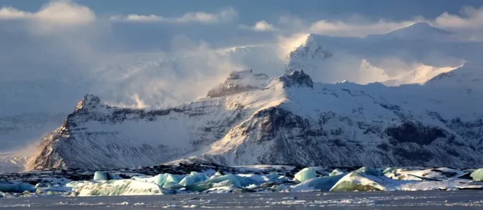 Framed Print : Winter view over frozen Jokulsarlon Glacier Lagoon showing blue icebergs covered in snow Framed Print : Winter view over frozen Jokulsarlon Glacier Lagoon showing blue icebergs covered in snow