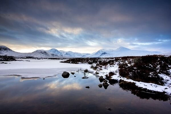Winter view across Lochain na h achlaise to the Black Mount hills at dusk