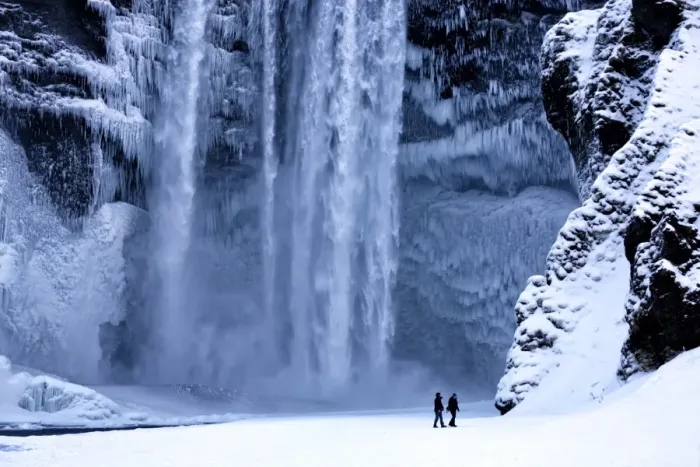 Framed Print : Winter view of Skogafoss waterfall, with cliffs covered in icicles and foregreound covered in snow Framed Print : Winter view of Skogafoss waterfall, with cliffs covered in icicles and foregreound covered in snow