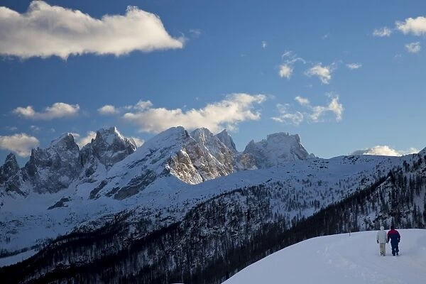 Winter walk around San Pellegrino pass, Pale di San Martino range in the background