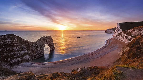 A winters sunset over Durdle Door on the Jurassic Coast, UNESCO World Heritage Site