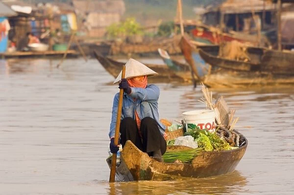 Woman in boat, Chong Kneas floating village, Tonle Sap Lake, Siem Reap