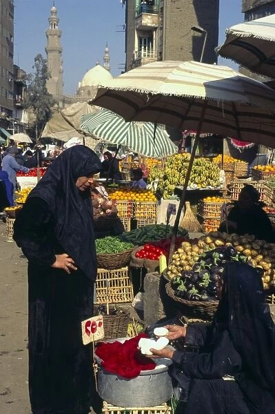 Woman buying cheese in market near the Citadel, Cairo, Egypt, North Africa, Africa
