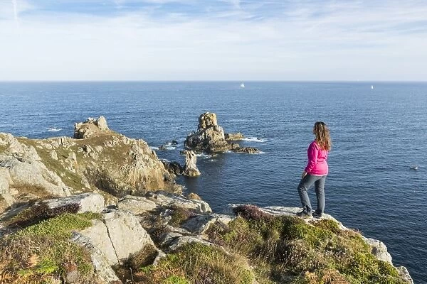 Woman on the cliffs of Van Point, Cleden-Cap-Sizun, Finistere, Brittany, France, Europe