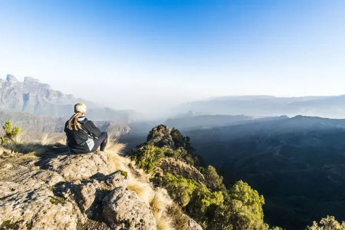 Framed Print : Woman enjoying the early morning sun on the cliffs, Simien Mountains National Park Framed Print : Woman enjoying the early morning sun on the cliffs, Simien Mountains National Park