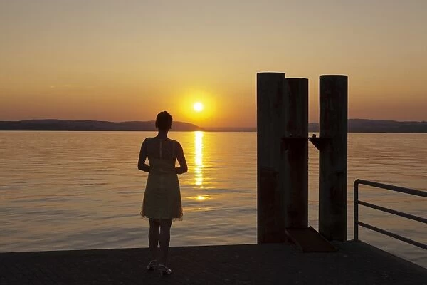 Woman enjoying the sunset, Unteruhldingen, Lake Constance, Baden Wurttemberg, Germany, Europe