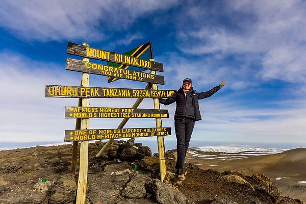 Woman excited she made it to Uhuru Peak on Mount Kilimanjaro, UNESCO World Heritage Site, Tanzania, East Africa, Africa