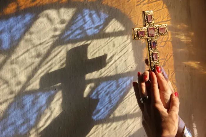 Framed Print : Woman holding a cross, Servoz, Haute-Savoie, France, Europe Framed Print : Woman holding a cross, Servoz, Haute-Savoie, France, Europe