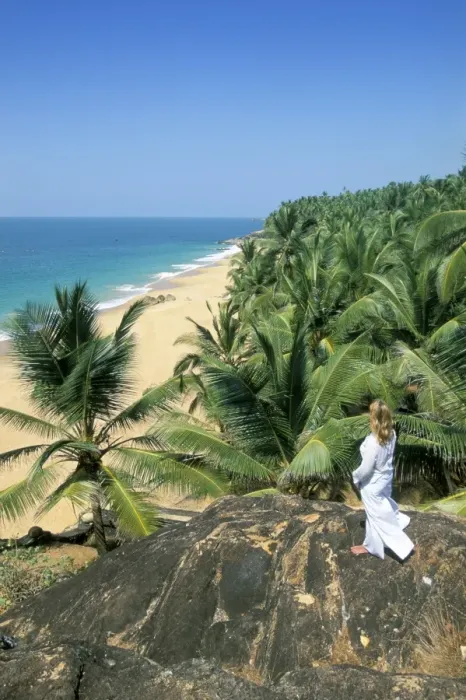 Framed Print : Woman looking over coconut palms to the beach Framed Print : Woman looking over coconut palms to the beach