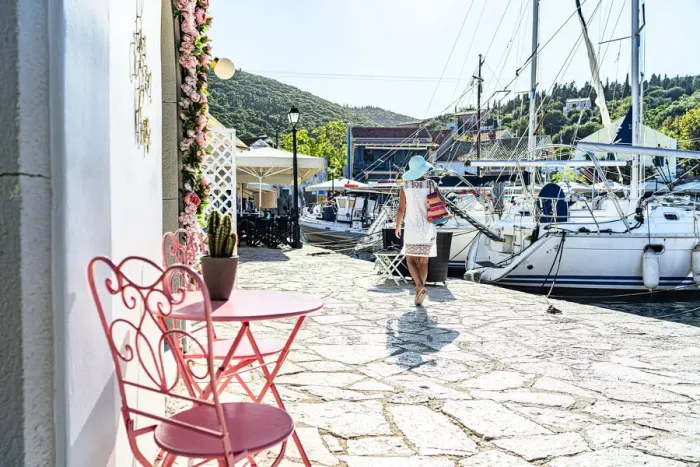 Framed Print : Woman looking at sailboats in the small harbor of the coastal village of Fiskardo, Kefalonia, Ionian Islands, Greek Islands, Greece, Europe Framed Print : Woman looking at sailboats in the small harbor of the coastal village of Fiskardo, Kefalonia, Ionian Islands, Greek Islands, Greece, Europe