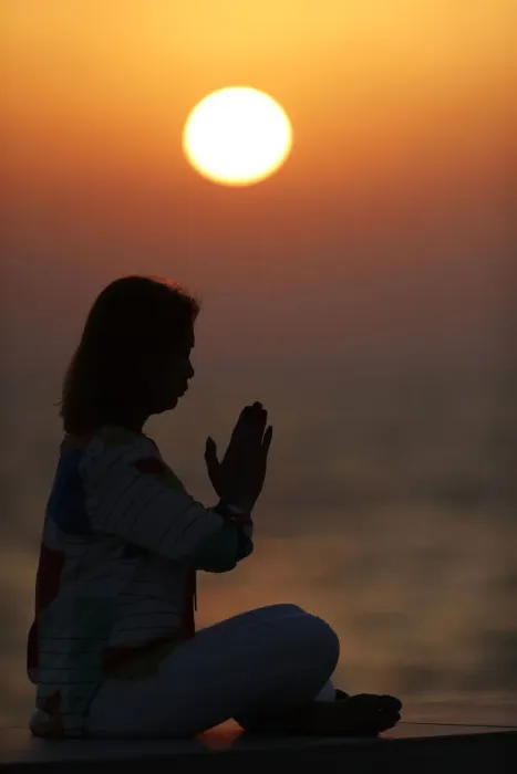 Framed Print : Woman practising yoga pose and meditation at sunset as concept for silence and relaxation Framed Print : Woman practising yoga pose and meditation at sunset as concept for silence and relaxation