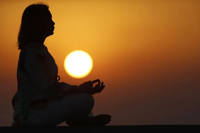 Framed Print : Woman practising yoga pose and meditation at sunset as concept for silence and relaxation Framed Print : Woman practising yoga pose and meditation at sunset as concept for silence and relaxation