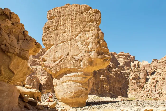 Framed Print : Woman practising yoga poses among sandstone rock formation in the desert canyons of the Ashar Valley, Medina Province, Saudi Arabia Framed Print : Woman practising yoga poses among sandstone rock formation in the desert canyons of the Ashar Valley, Medina Province, Saudi Arabia