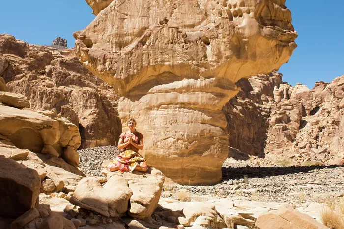 Framed Print : Woman practising yoga poses among sandstone rock formation in the desert canyons of the Ashar Valley, Medina Province, Saudi Arabia Framed Print : Woman practising yoga poses among sandstone rock formation in the desert canyons of the Ashar Valley, Medina Province, Saudi Arabia