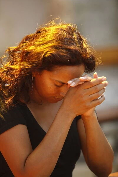 Woman praying, Galatone, Lecce, Italy, Europe