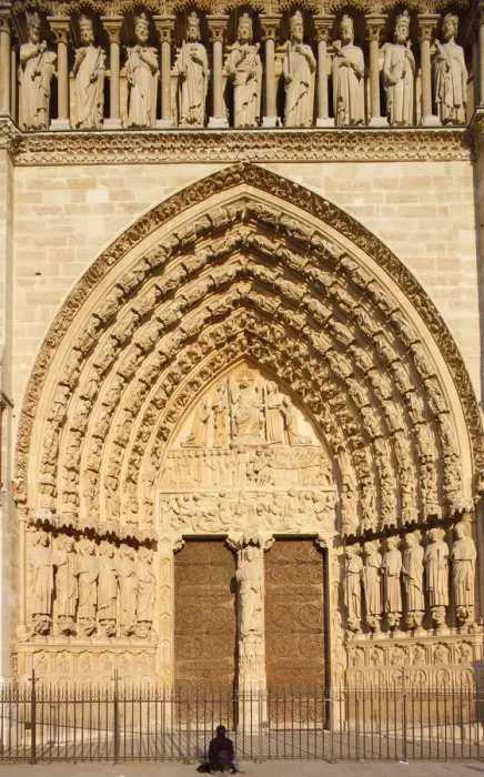 Framed Print : Woman praying in front of Last Judgment gate, west front, Notre Dame Cathedral Framed Print : Woman praying in front of Last Judgment gate, west front, Notre Dame Cathedral