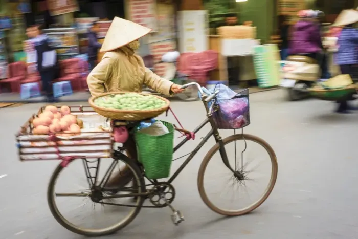 Framed Print : Woman pushing a bicycle in Old Quarter, Hoan Kiem District, Hanoi, Vietnam, Indochina Framed Print : Woman pushing a bicycle in Old Quarter, Hoan Kiem District, Hanoi, Vietnam, Indochina