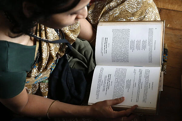 Woman reading the Bhagavad Gita, Sarcelles, Val d Oise, France, Europe