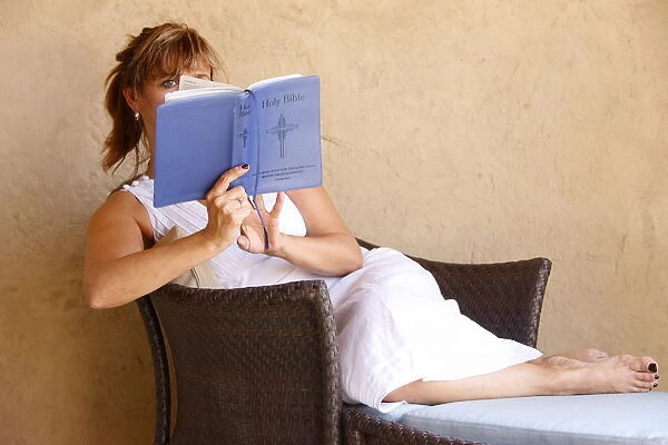 Woman reading the Bible, Abu Dhabi, United Arab Emirates, Middle East