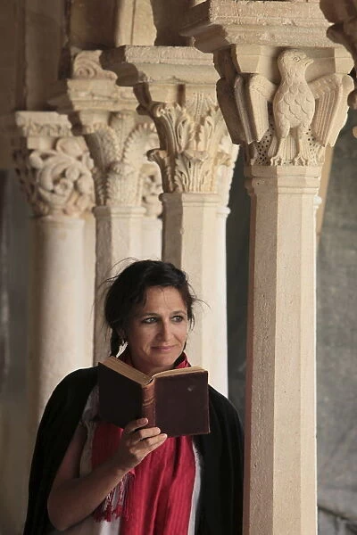 Woman reading the Bible in the Cloister of Saint Sauveur, Aix en Provence