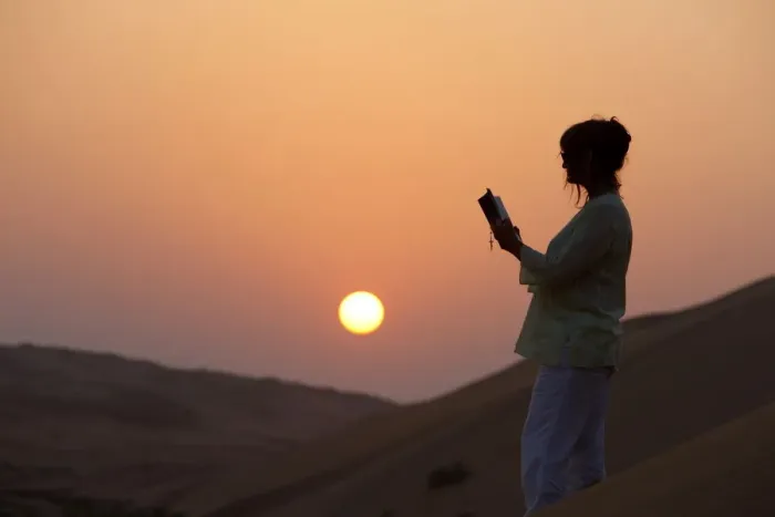 Framed Print : Woman reading the Bible in the desert, Abu Dhabi, United Arab Emirates, Middle East Framed Print : Woman reading the Bible in the desert, Abu Dhabi, United Arab Emirates, Middle East