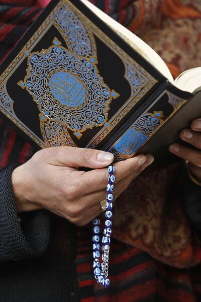 Woman reading Koran, Jordan, Middle East