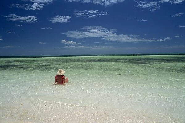 Woman in the sea on the beach at Cayo Coco on the island of Cuba, West Indies
