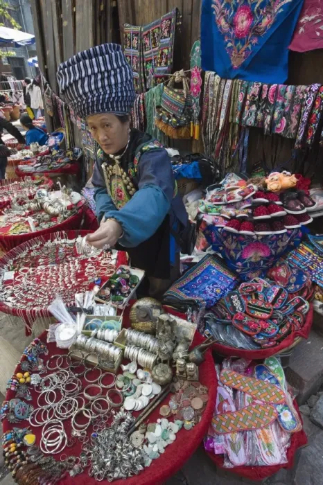 Framed Print : Woman selling ethnic souvenirs at a market in Fenghuang, Hunan Province, China, Asia Framed Print : Woman selling ethnic souvenirs at a market in Fenghuang, Hunan Province, China, Asia