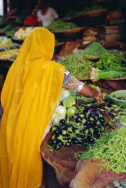 Woman shopping for vegetables at a market in Jodphur