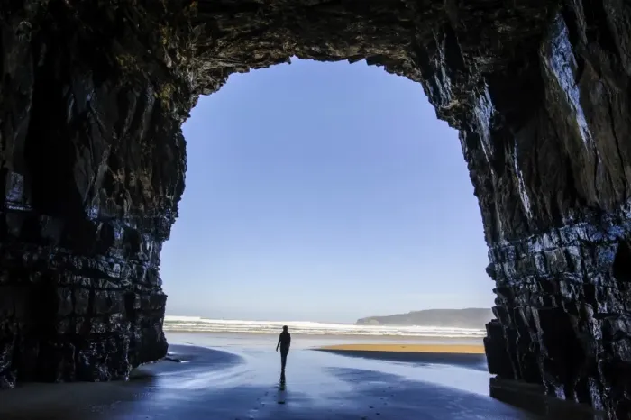 Framed Print : Woman standing in the giant Cathedral caves, The Catlins, South Island, New Zealand, Pacific Framed Print : Woman standing in the giant Cathedral caves, The Catlins, South Island, New Zealand, Pacific