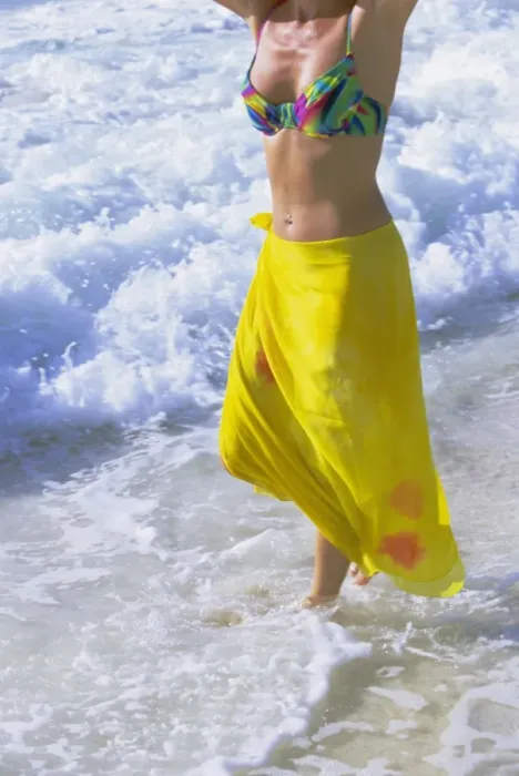 Framed Print : Woman standing in the surf