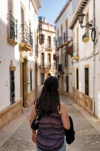 Woman in street of historic white village, Ronda, Pueblos Blancos, Andalusia, Spain, Europe