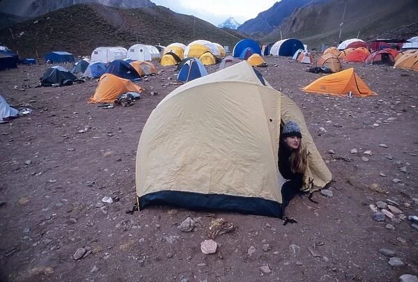 Woman wakes up at Confluencia Base Camp in Aconcagua National Park, Argentina