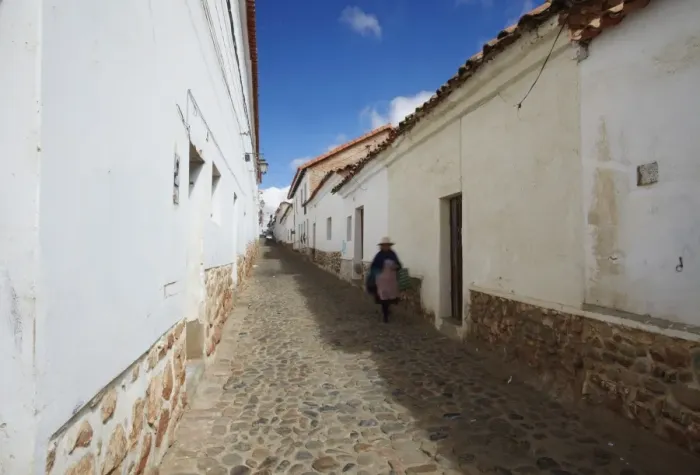 Framed Print : Woman walking along alleyway, Sucre, UNESCO World Heritage Site, Bolivia, South America Framed Print : Woman walking along alleyway, Sucre, UNESCO World Heritage Site, Bolivia, South America