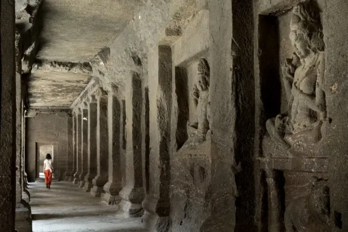Framed Print : A woman walking through a corridor in the Hindu temple in the Kailash (Kailaszanatha)