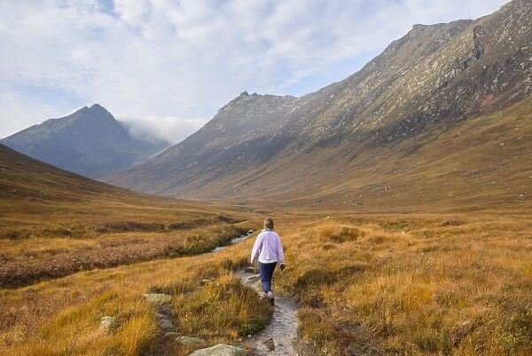 Woman walking in Glen Sannox, Isle of Arran, North Ayrshire, Scotland, United Kingdom