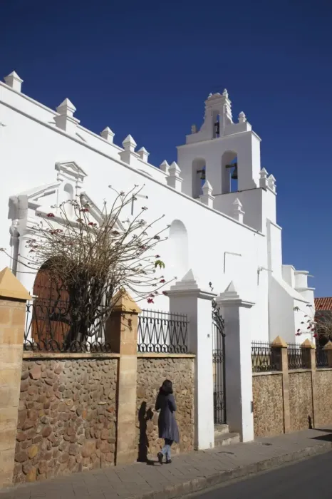 Framed Print : Woman walking past Iglesia de Santo Domingo, Sucre, UNESCO World Heritage Site, Bolivia, South America Framed Print : Woman walking past Iglesia de Santo Domingo, Sucre, UNESCO World Heritage Site, Bolivia, South America