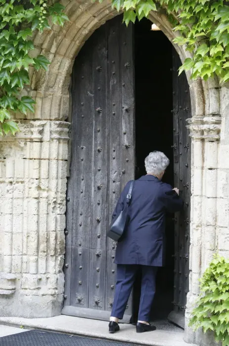 Framed Print : Woman walking into Saint-Pierre de Solesmes Abbey church, Solesmes, Sarthe Framed Print : Woman walking into Saint-Pierre de Solesmes Abbey church, Solesmes, Sarthe