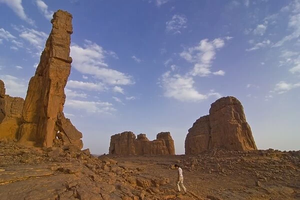 Woman walking around wonderful rock walls, Tasset, Algeria, North Africa, Africa