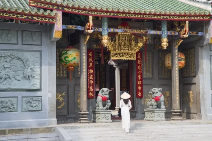 Framed Print : Woman wearing ao dai dress at Nghia An Hoi Quan Pagoda, Cholon, Ho Chi Minh City