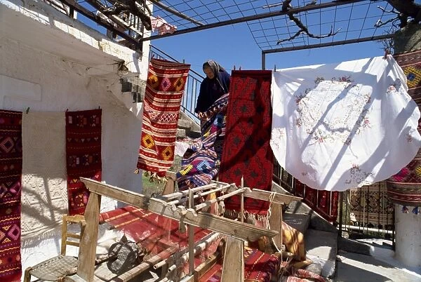 Woman weaver selling her blankets in village near Lasithi Plateau