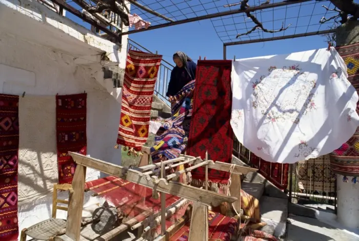 Framed Print : Woman weaver selling her blankets in village near Lasithi Plateau Framed Print : Woman weaver selling her blankets in village near Lasithi Plateau
