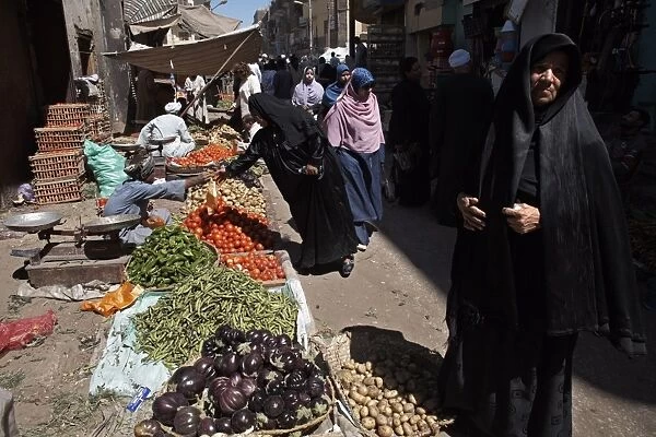 Women buying fruit and vegetables at Luxor Souq, Egypt, North Africa, Africa