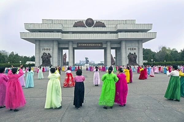 Women in colourful traditional dresses at mass dancing, Pyongyang, Democratic Peoples Republic of Korea (DPRK), North Korea, Asia