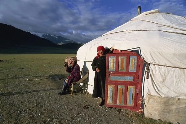 Two women outside a ger (yurt)